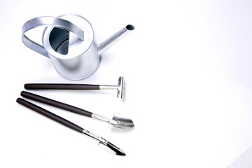 Flowers and garden tools isolated on white backgroud