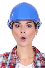 Female worker with look of surprise on face