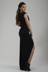 Fototapeta premium elegant woman in fashionable dress posing in the studio