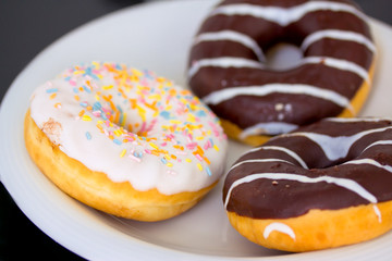 Obraz na płótnie Canvas close-up shot of delicious doughnuts