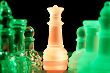 multicolored chess pieces in dark
