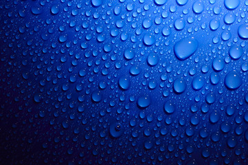 blue water drops on glass