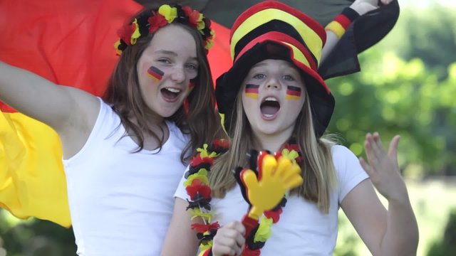 two girls cheering for the german soccer team with sound