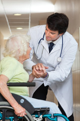 Obraz premium Doctor Comforting Senior Patient At Hospital