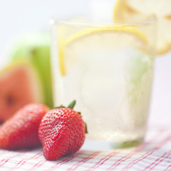 cocktail with ice,lemon, fig,apple and strawberries
