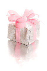 Tiny gift packet with reflection and white background