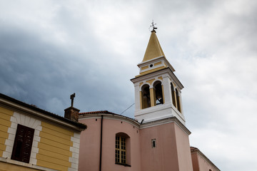 Fototapeta na wymiar Bell Tower of Porec Church in Croatia