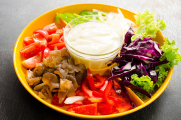 vegetable salad in orange bowl