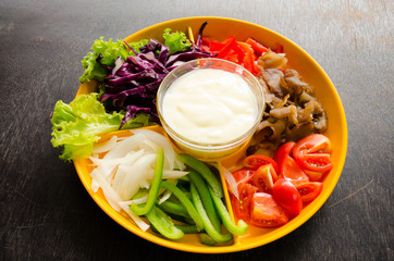 vegetable salad in orange bowl