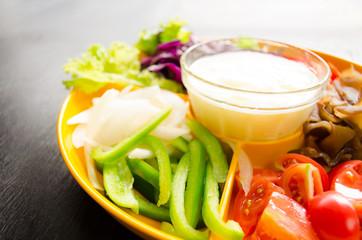 vegetable salad in orange bowl