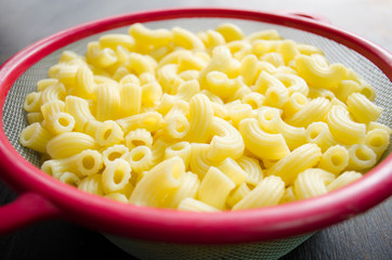 raw macaroni in bowl ready for cooking