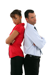 couple standing back to back after quarrel