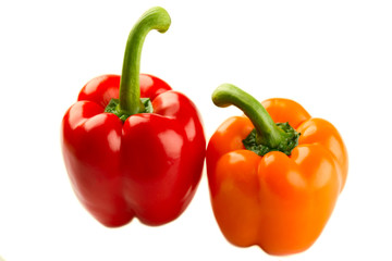 Red and orange pepper on white