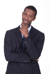 Cheerful businessman thinking