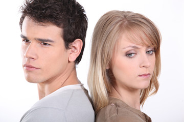 Couple stood back to back following argument