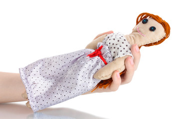 Voodoo doll girl in the hands of women isolated on white