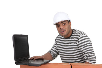 Builder with a laptop
