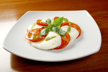 Arrangement of mozzarella and tomatoes