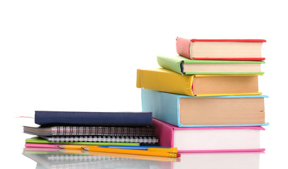 Books with stationery isolated on white