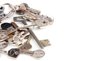 Lot of metal keys isolated on white