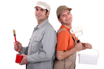 Two painters back to back, studio shot