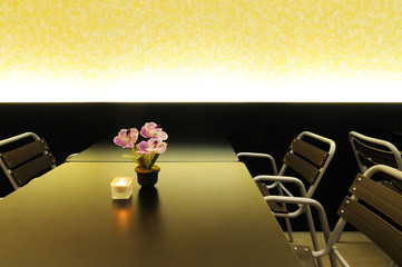 modern dining table with chairs, flower and candle, romantic