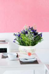 dining table set with dish and flower