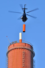 TV transmitter installation on the chimney with a helicopter. © Tomasz Warszewski