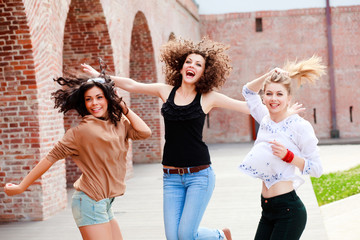 three beautiful women laughing and having fun