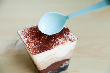 Piece of Banoffee cake on wood pattern background