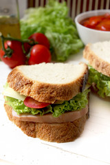 sandwich with tomato, cheese, bacon and salad