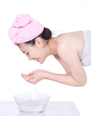 Profile portrait of woman washing face
