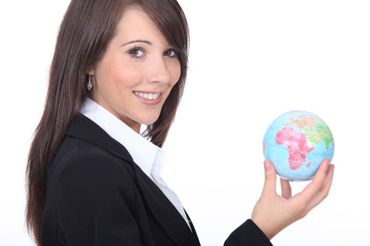 Young businesswoman with the world in her hands - Powered by Adobe