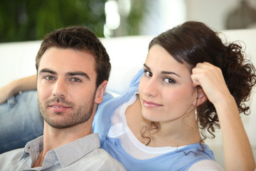 Couple laying on sofa