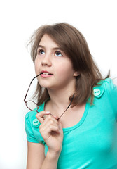 Attractive teenage girl deliberates a decision looking up