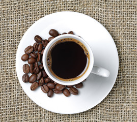 Cup of coffee on a background fabric