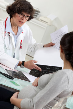 Pregnant patient receiving the results of a scan