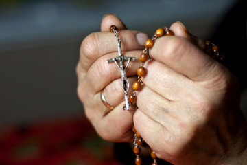 prayer old woman hands and rosary