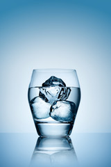 Ice in glass of vodka.