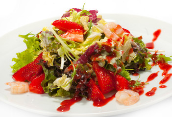 Fresh salad with seafood and strawberries