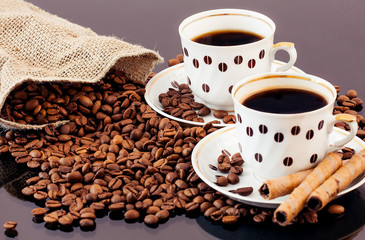 warm cup of coffee on brown background