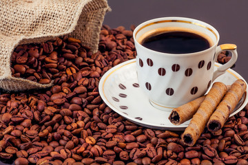 warm cup of coffee on brown background