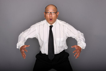 Surprised asian man wearing necktie. © Peter Kim