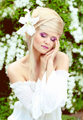 Fototapeta premium Young pretty woman with beautiful blond hairs and multicolor mak