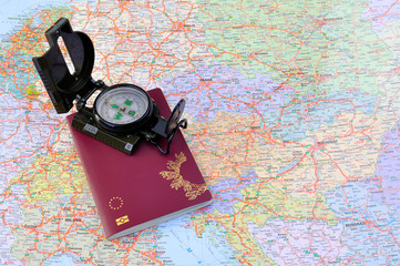 passport with compass and map