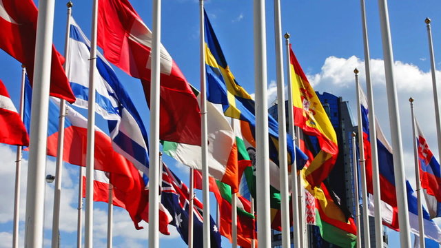 Flags of the different countries on a background of the blue sky