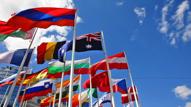 Flags of the different countries on a background of the blue sky