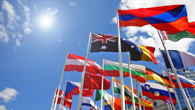 Flags of the different countries on a background of the blue sky