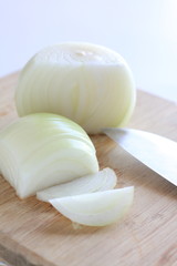 Sliced Onion on wooden chopping board