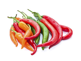 green orange red chilli on white back ground